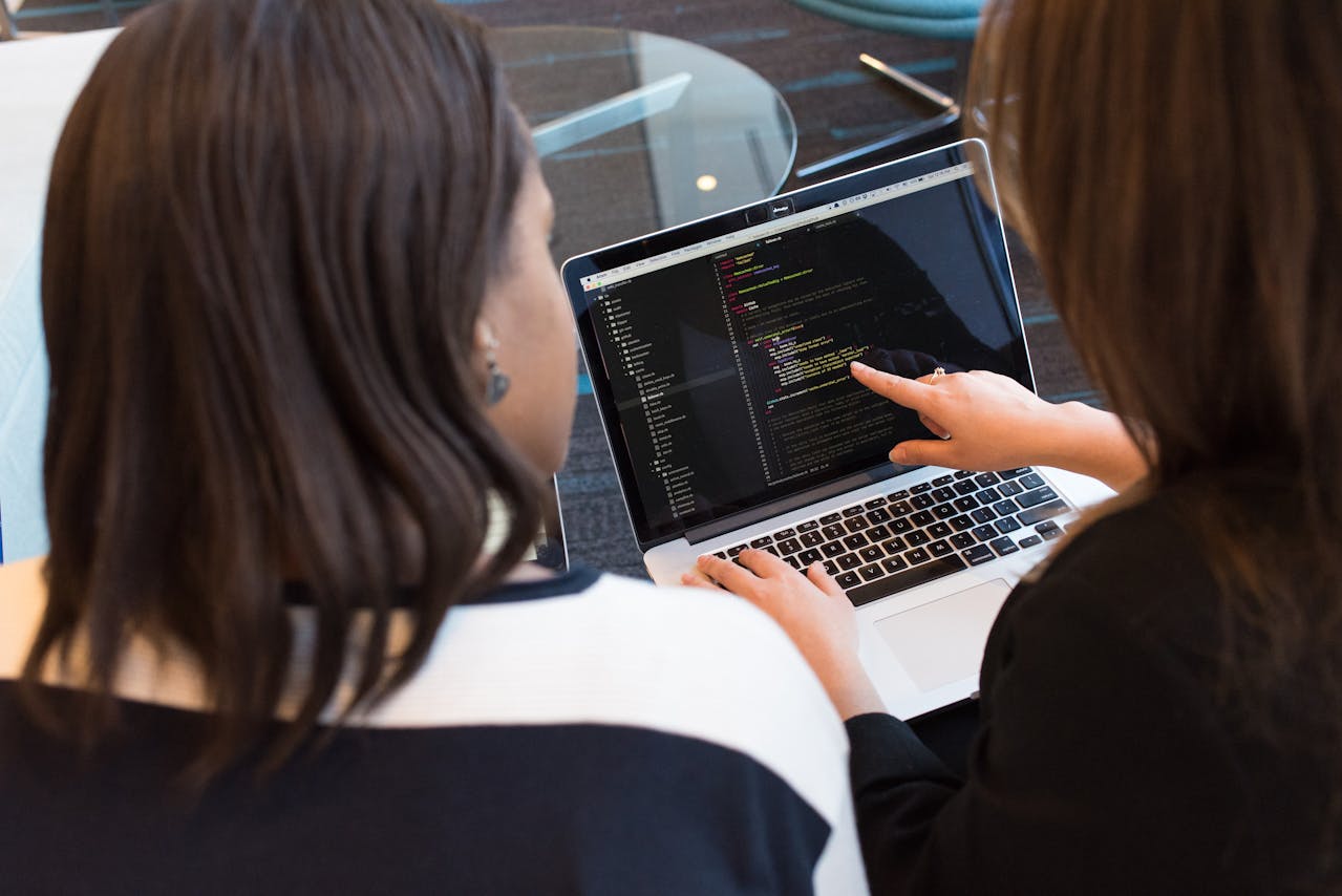 Web developers checking website code to optimize for site speed